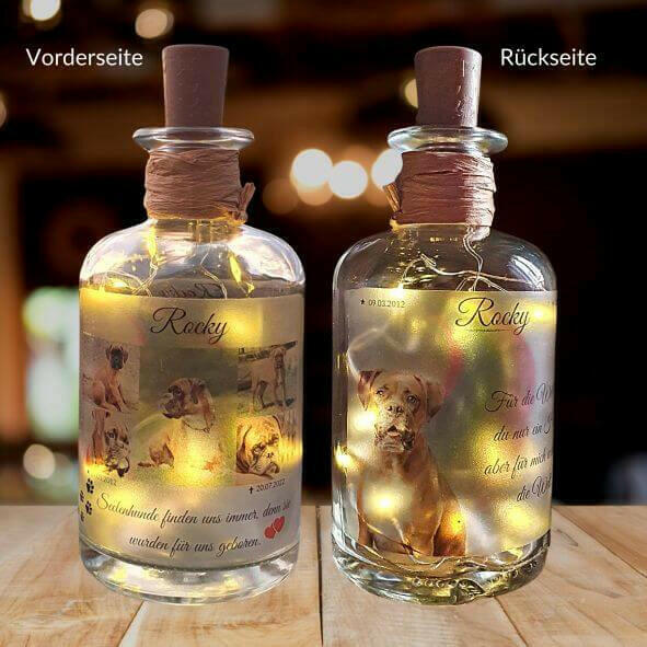 Leuchtende Flasche, auf der an der Vorder- und Rückseite Hundebilder sind.